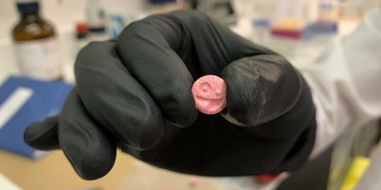 Ecstasy pill with smiley face