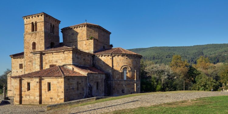 PY7559 Collegiate church of Santa Cruz de Castaneda from the 12th century declared a National Monument Cantabria Spain...