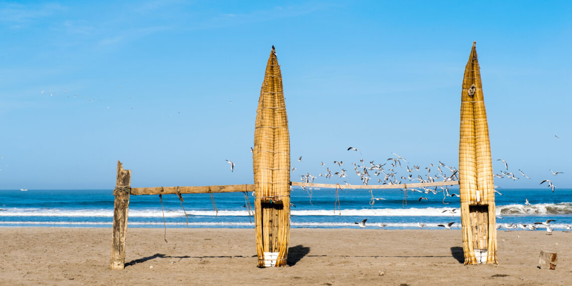 Traditional Peruvian small Reed Boats (Caballitos de Totora), straw boats still used by local fishermens in Peru