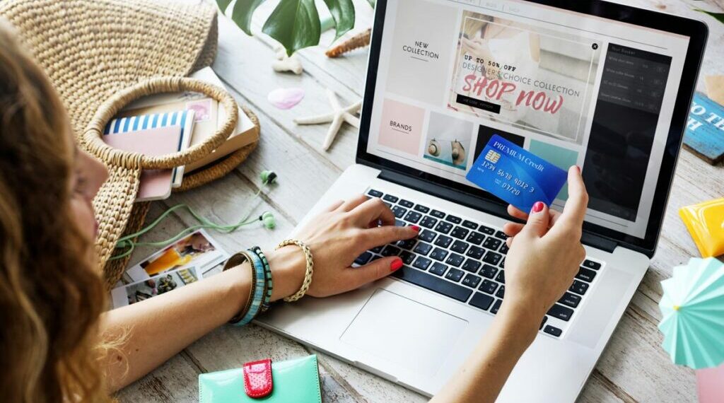 A girl using her laptop to shop online.