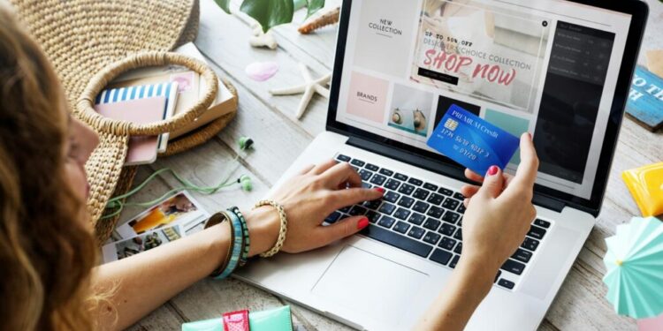 A girl using her laptop to shop online.