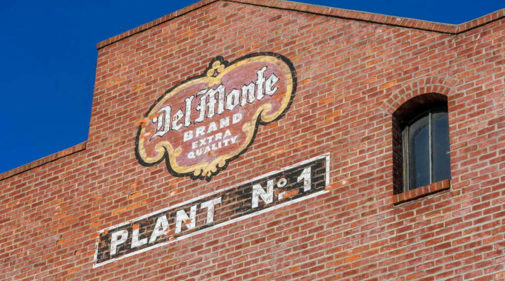 Del Monte painted sign on brick building