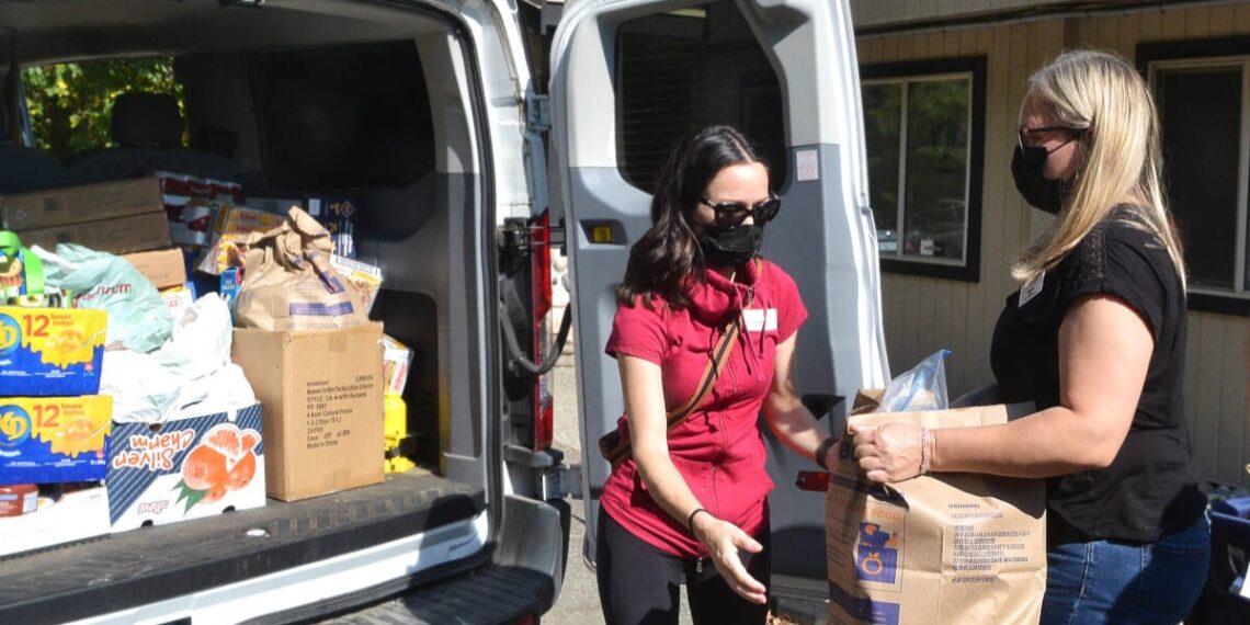 Annual Thanksgiving food drive fills van with donations for Langley food banks