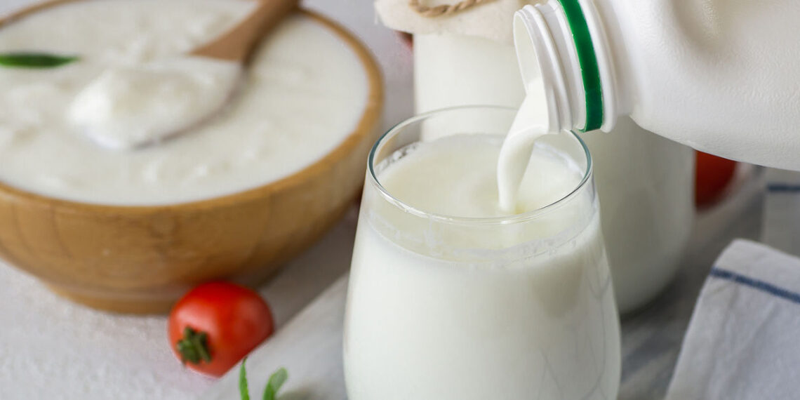 Glass cup of Turkish traditional drink ayran , kefir or buttermilk made from yogurt, healthy food