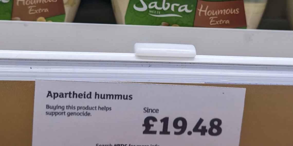 Street Artist Slaps Anti-Genocide Warning Labels on Israeli Foods in Supermarket