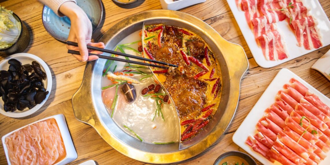 Hot pot with an assortment of fixings. (Photo: Getty Images)