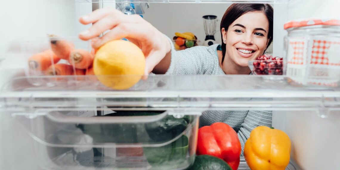 Woman looking inside a fridge