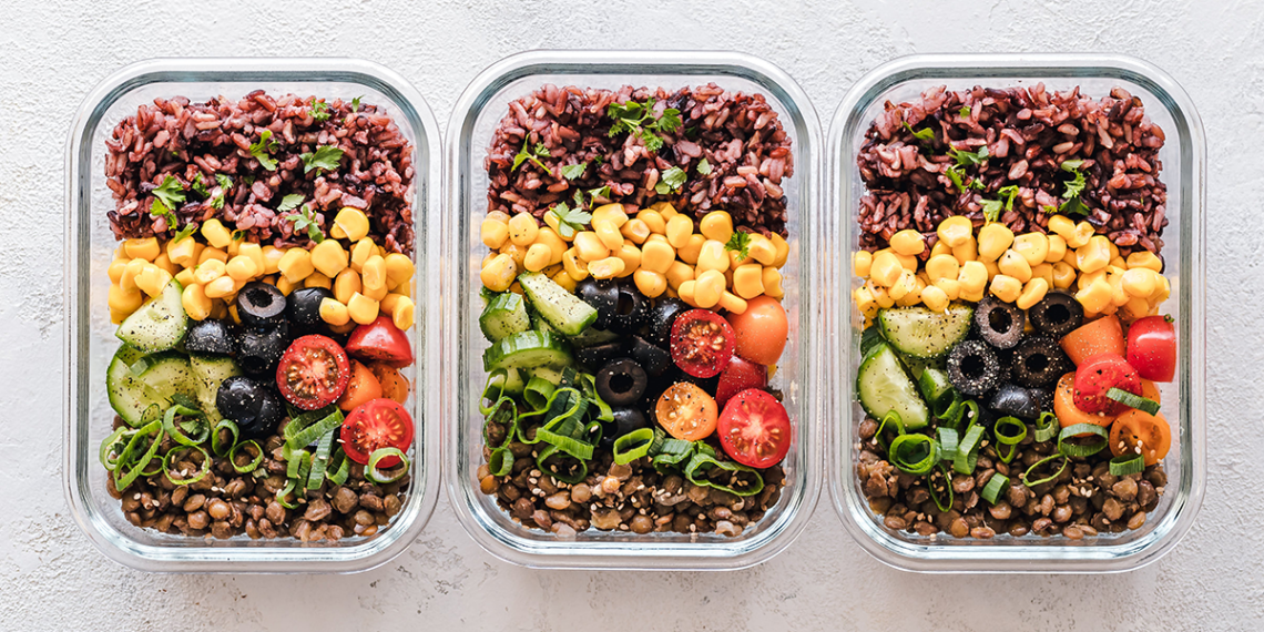 Three containers, each filled with a variety of colorful fruits, vegetables and legumes.