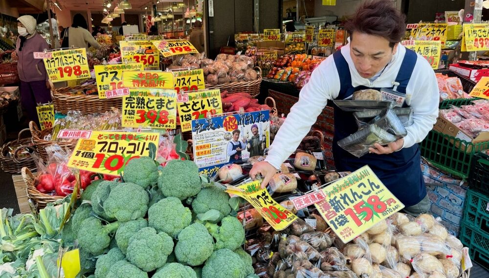 A man works at a supermarket in Tokyo last month. Price increases backed by higher ingredient costs have started to come back due to unstable weather, Teikoku Databank has said.
