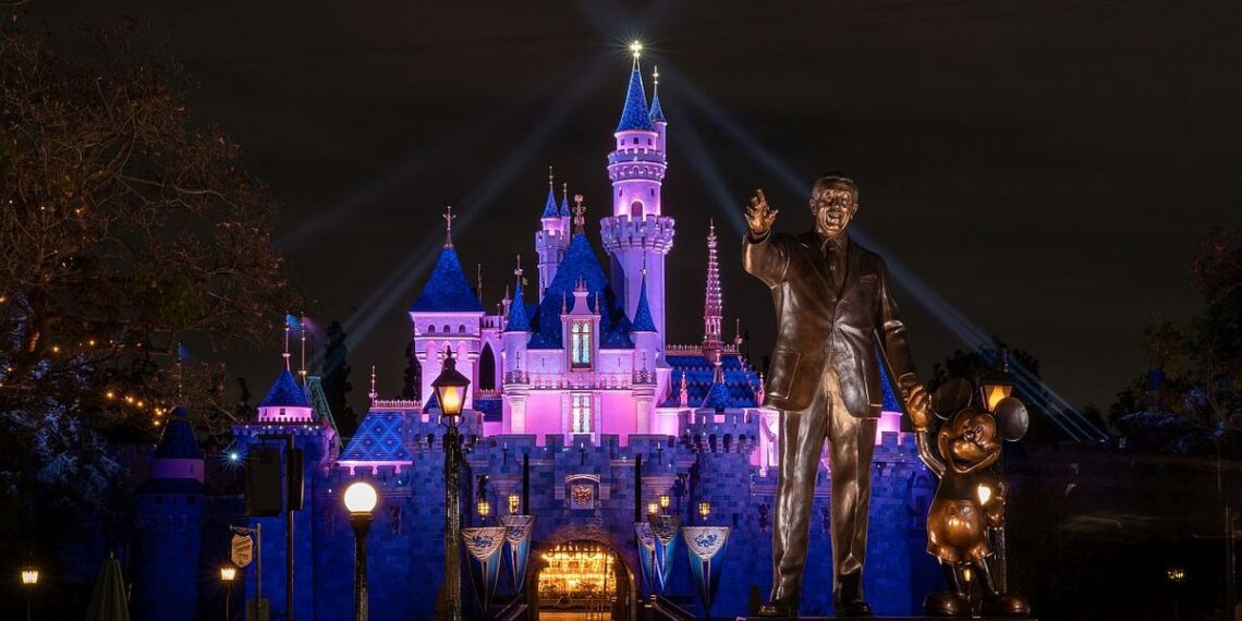 Partners statue and Sleeping Beauty Castle at night