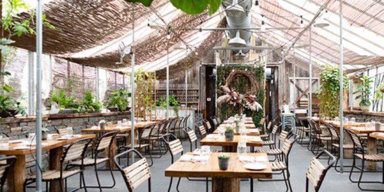 An indoor/outdoor dining scene at Terrain Cafe.