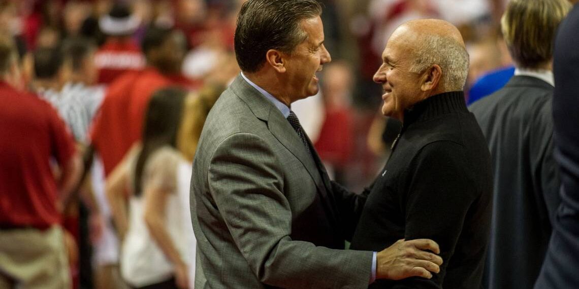 Kentucky head coach John Calipari talks with Tyson Foods chairman John Tyson before a 2014 game against the Arkansas Razorbacks at Bud Walton Arena. The two are longtime friends.