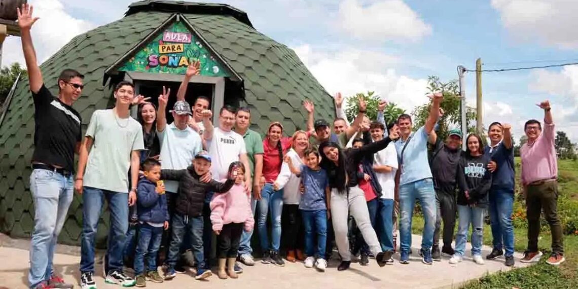 A group of adults and children posed cheering.